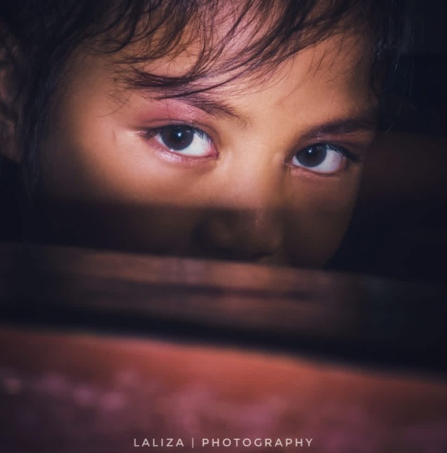 Close-up portrait with expressive eyes and shadow