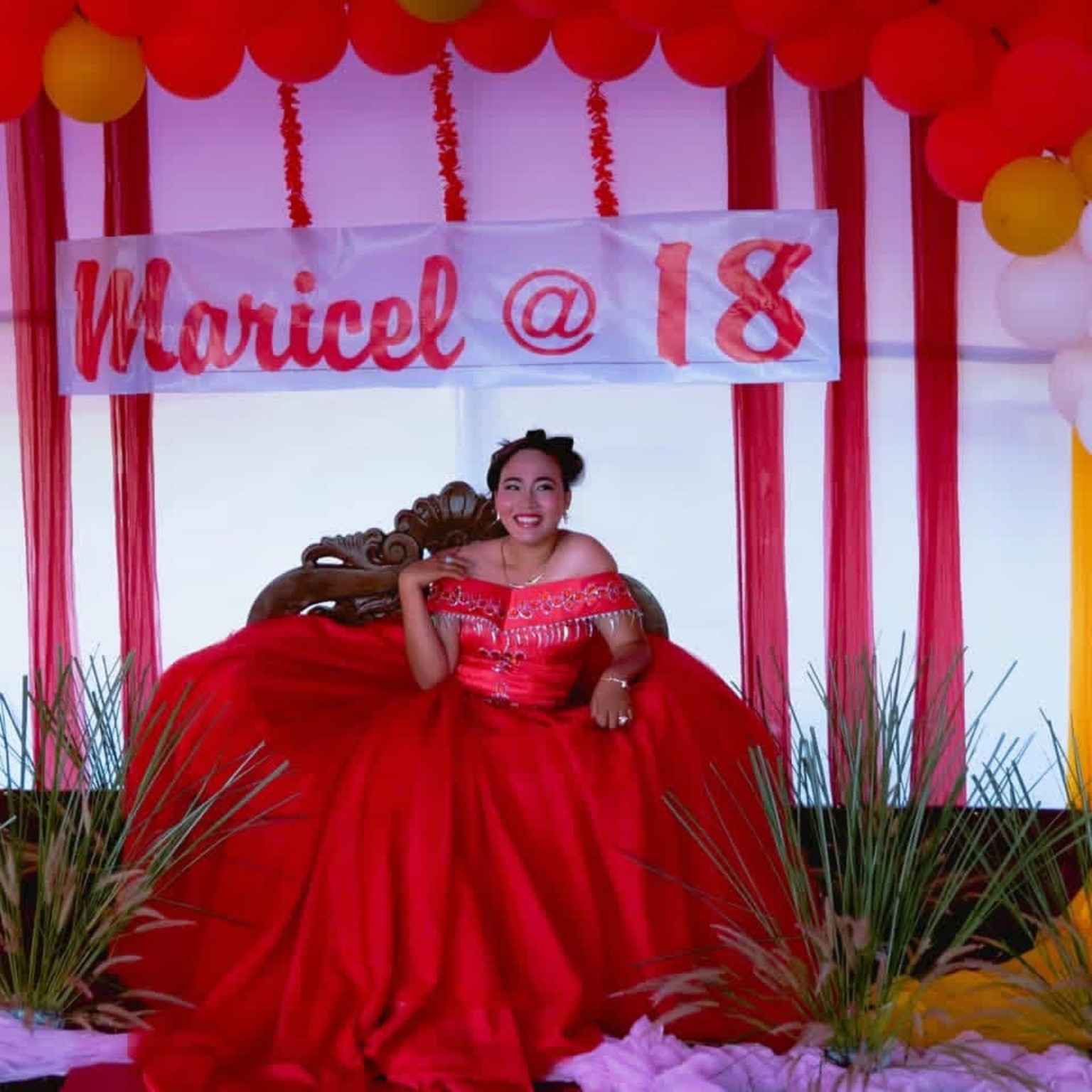 Birthday celebration portrait with red decorations