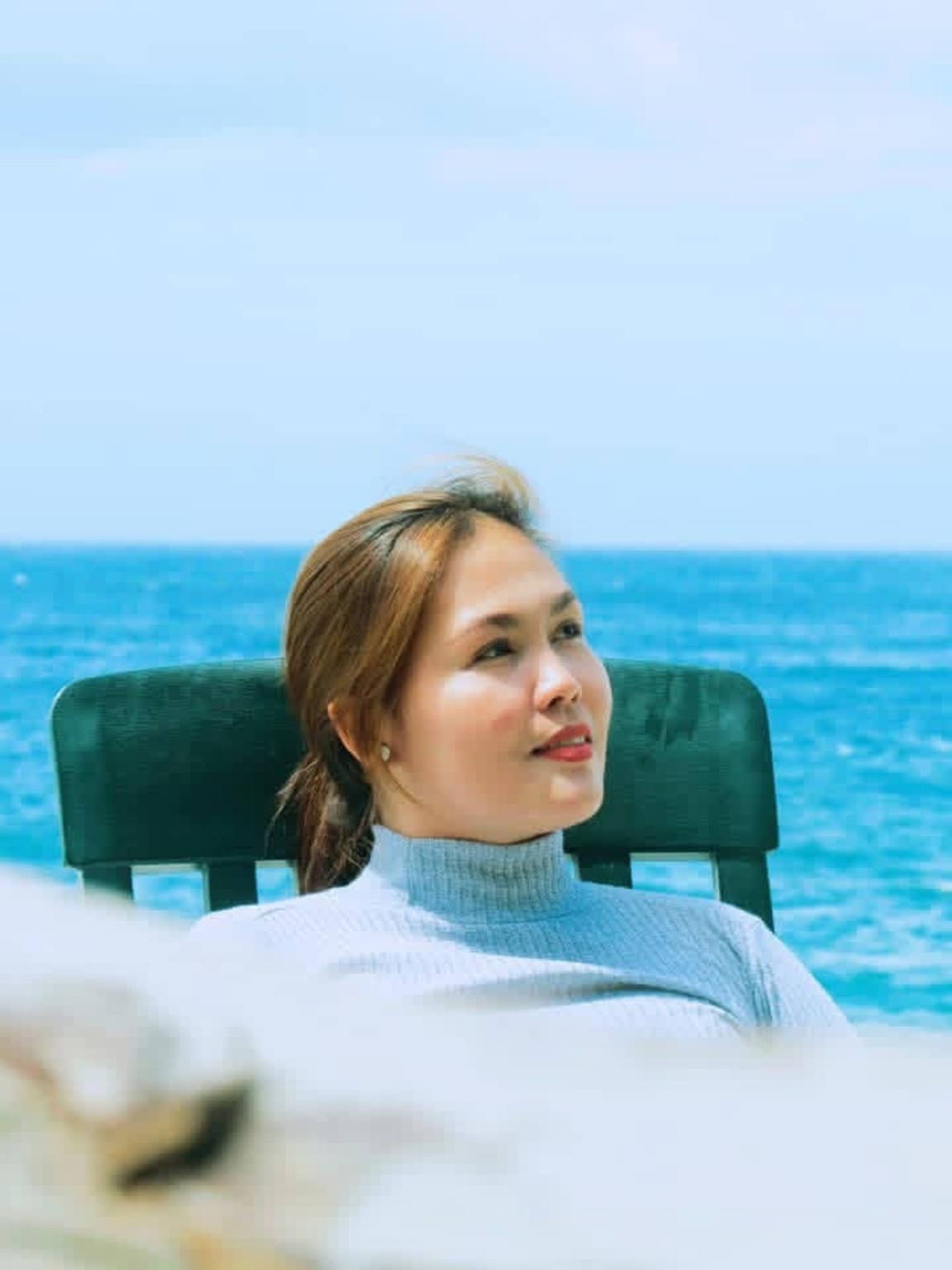 Woman relaxing beside the sea